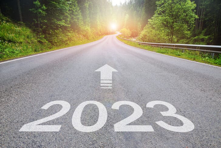 Image of a roadway with 2023 and and arrow pointing forward