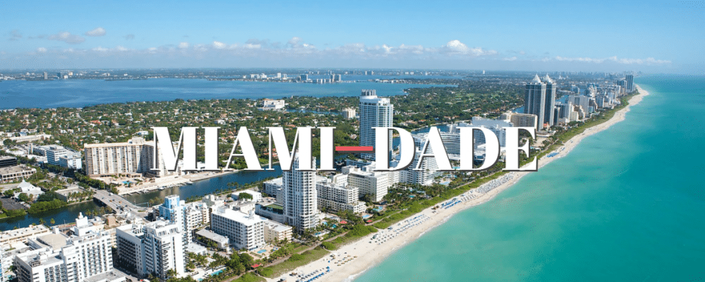 Picture of condos on a beach with miami-dade superimposed on top