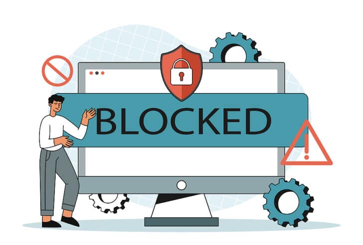 Image of a computer screen with the word "blocked" in front of it
