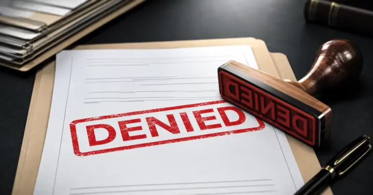 rubber stamp with denied on it