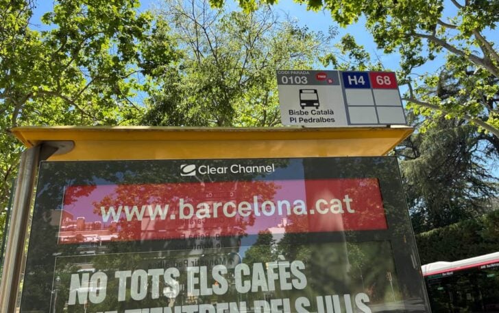 Barcelona.cat on the side of a bus stop