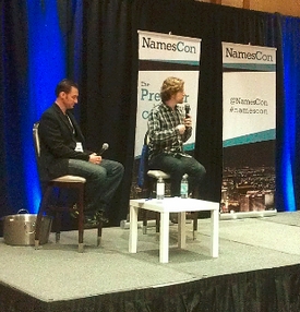Matt Mullenweg (right) speaking at NamesCon.