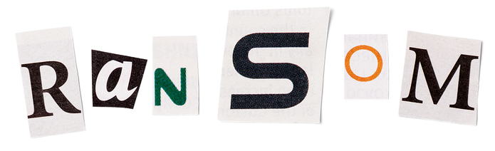 Cut out letters spelling the word "ransom"