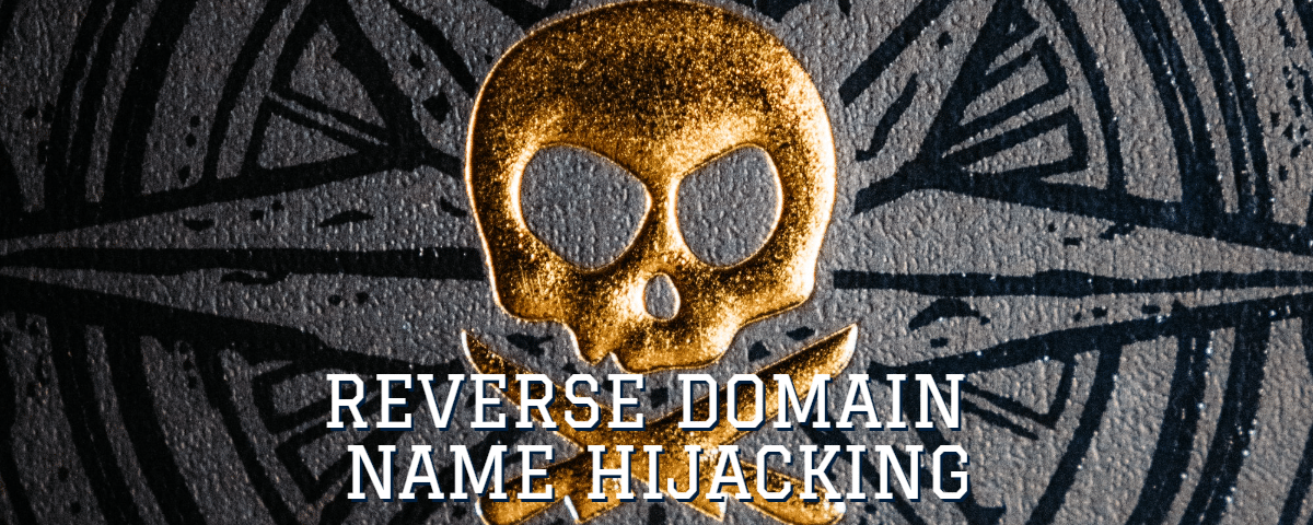 Picture of a gold skull and crossbones with the words "reverse domain name hijacking"