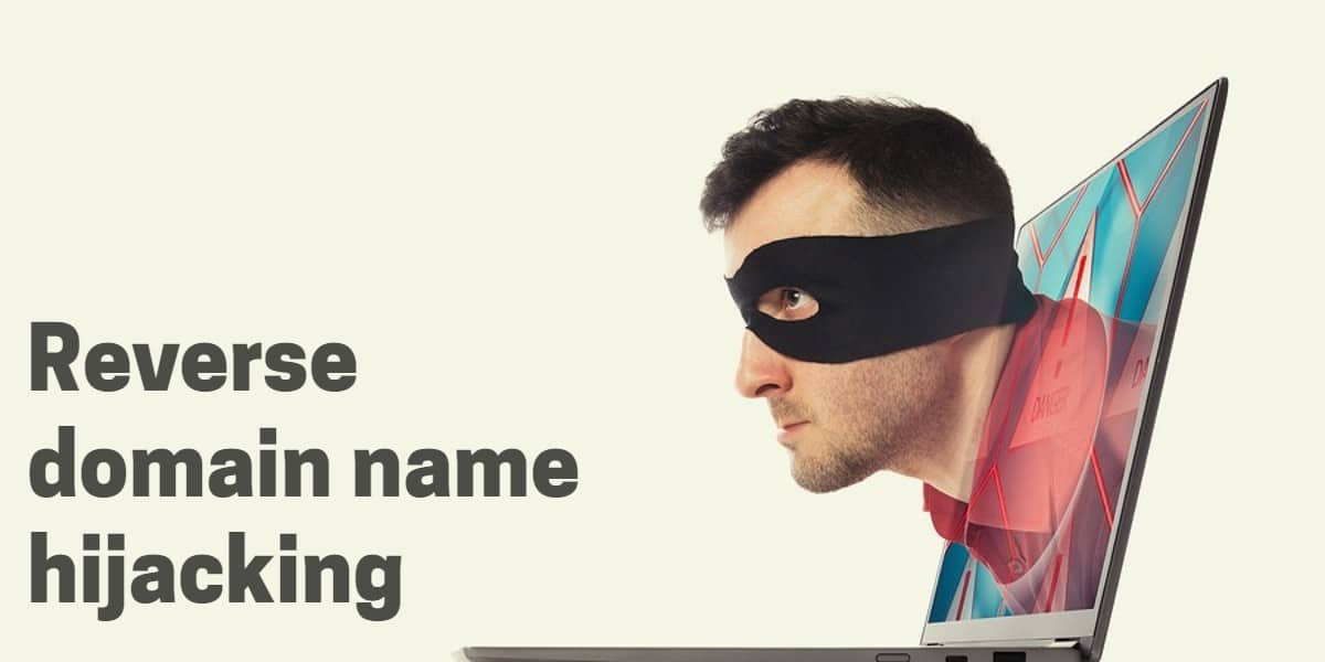 A picture of a man's face with an eye cover coming out of a laptop screen with the words "reverse domain name hijacking"