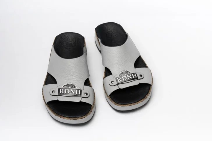 Fancy leather sandals with the brand RDNH on them