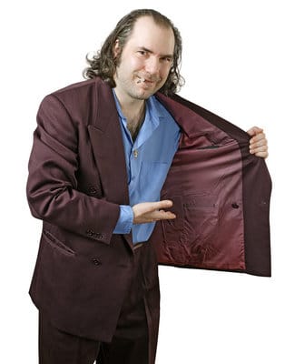 Picture of sleazy salesman gesturing to the inside of his burgundy coat