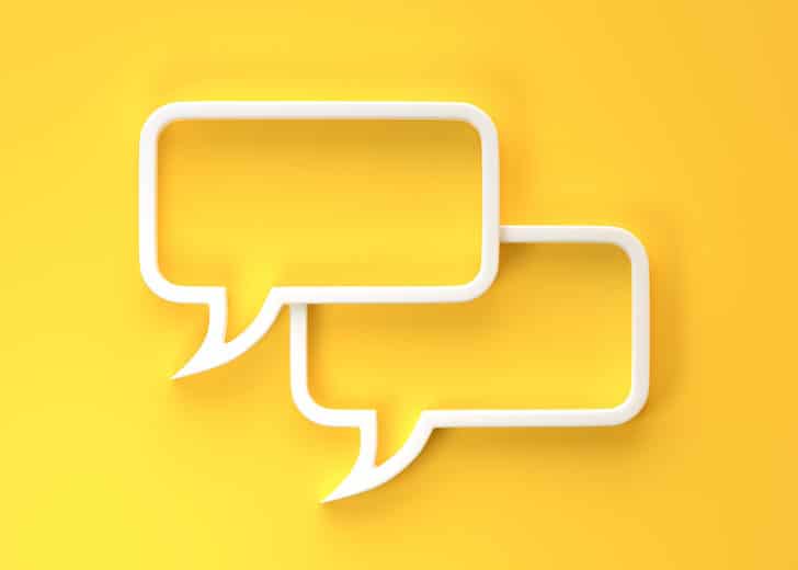 Two white speech bubbles on a yellow background