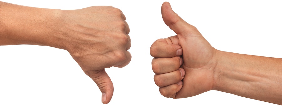 Picture of a hand giving a thumbs down and a hand giving a thumbs up