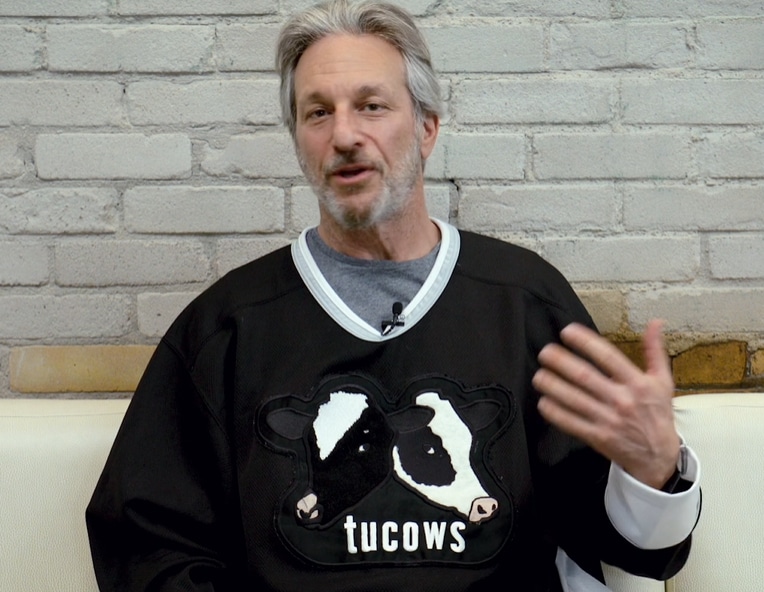 Picture of Tucows CEO Elliot Noss wearing a Tucows hockey sweater